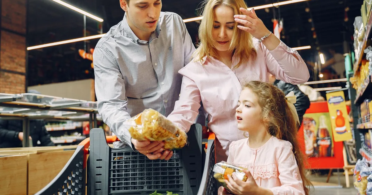 Shoppers in a supermarket aisle